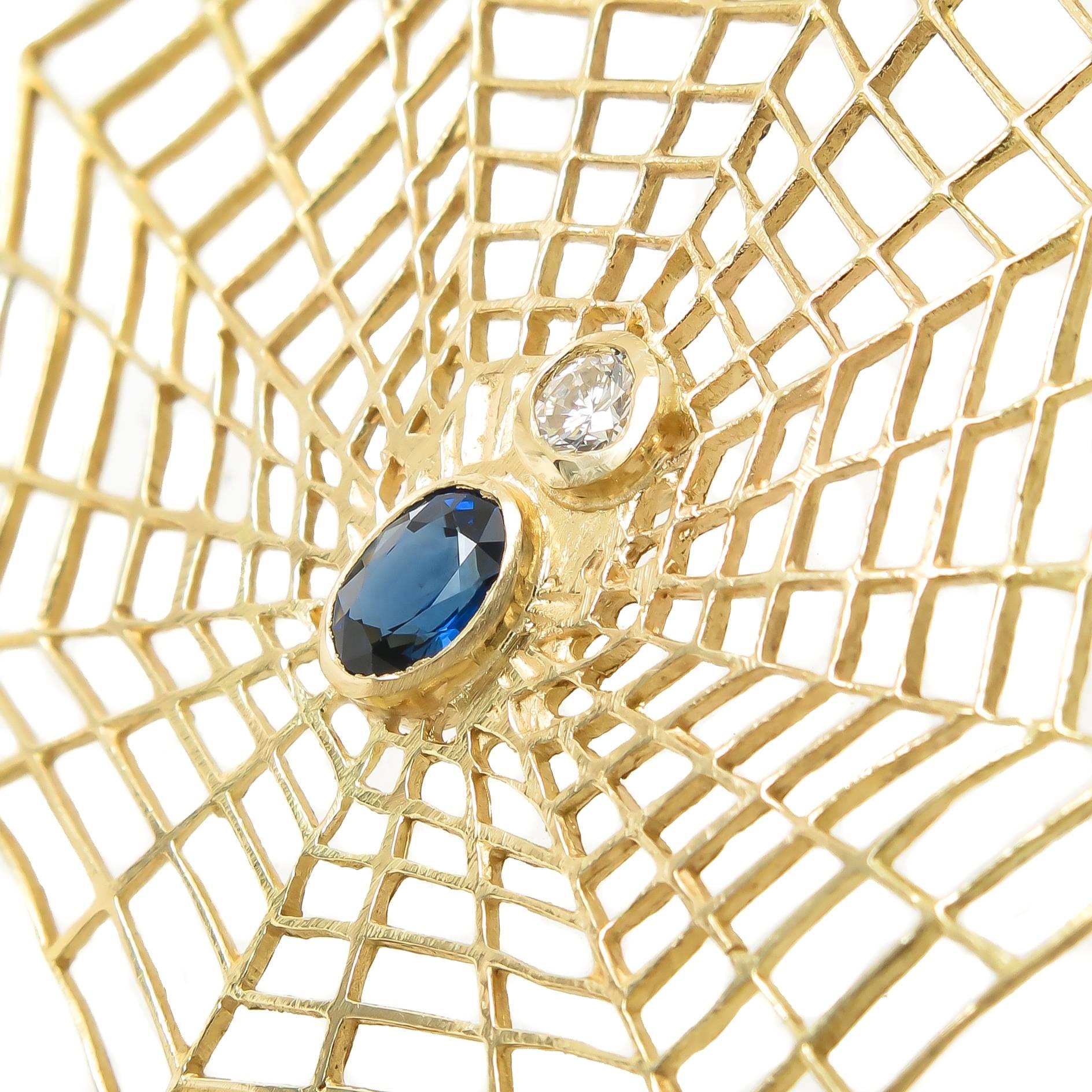 Circa 1980 large and fun 18K yellow Gold Spider Web earrings, measuring 2 3/8 inch in length and 1 7/8 inch in diameter. Set with very fine color Sapphires total 1 Carat and Round Brilliant cut Diamonds grading as H in Color and VS in clarity and