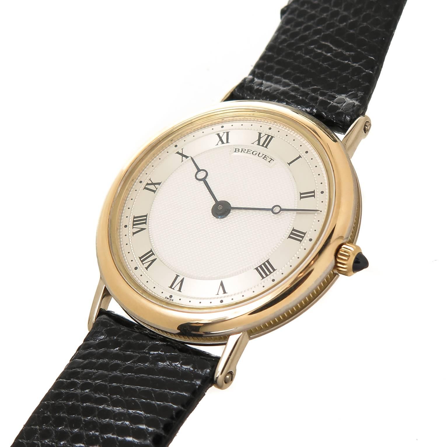 Circa 2005 Breguet Reference 3169 Wrist Watch. 33 MM White and Yellow Gold case,5 MM thick. Quartz Movement, Engine turned Silvered Dial with Black Roman Numerals, classic Breguet Hands and a Sapphire Crown. New Black Lizard Strap, total watch
