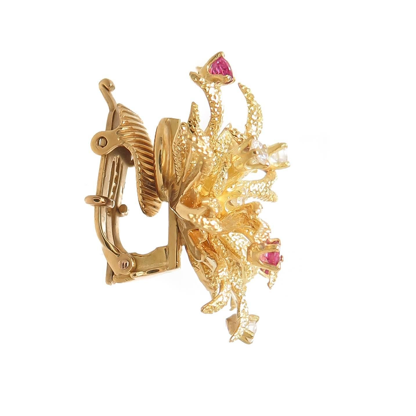 Circa 1970s Tiffany & Company Earrings and Brooch Suite, 18K Yellow Gold and set with Round Brilliant cut Diamonds and fine color Rubies. This suite is designed as textured Floral Branches in the style of Jean Schlumberger Jewelry.  The earrings