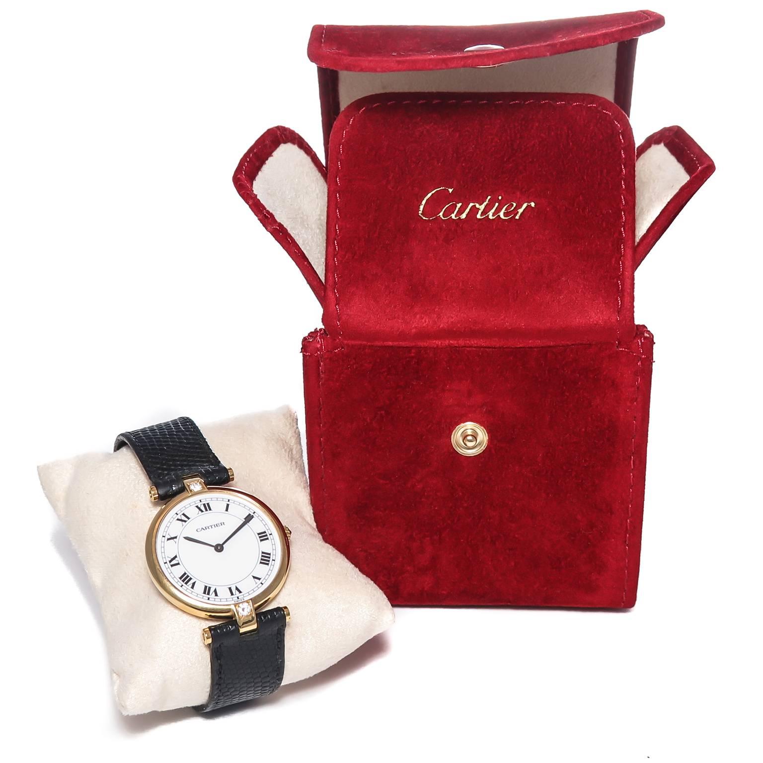 Circa 2000 Cartier Vendome Collection Wrist Watch, 30 MM 18K Yellow Gold case set with a Diamond at each end of the case as well as as a Diamond set in the crown. Quartz Movement, White Dial with Black Roman Numerals. Original Cartier Black Lizard