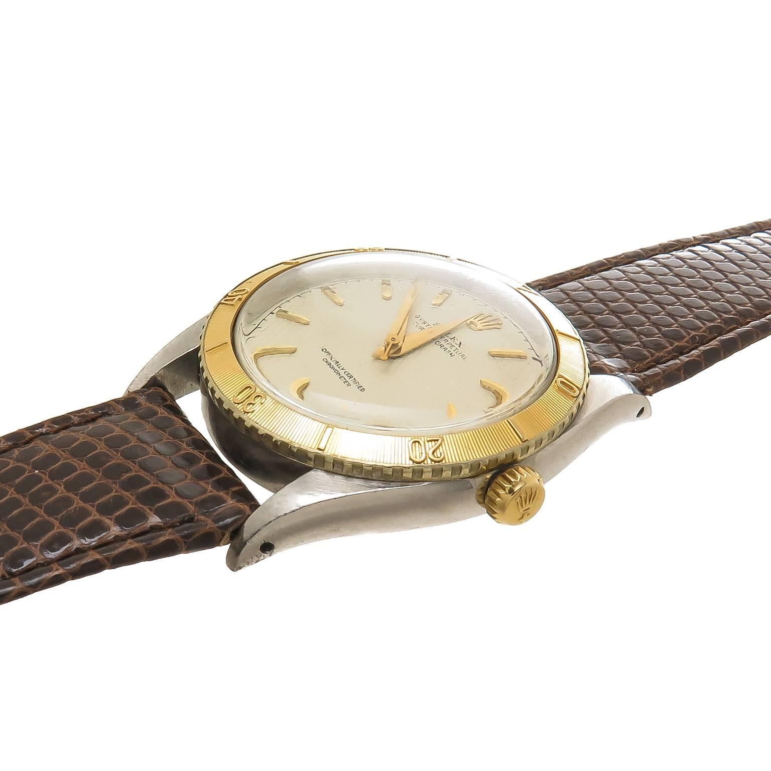Circa 1954 Rolex Turn O Graph Reference 6202, 36 MM Stainless Steel 3 Piece case with Yellow Gold Thunderbird Bezel. Original Mint Condition White Waffle Dial with raised Gold markers. Automatic Self winding Movement. Original Rolex Brown Lizard