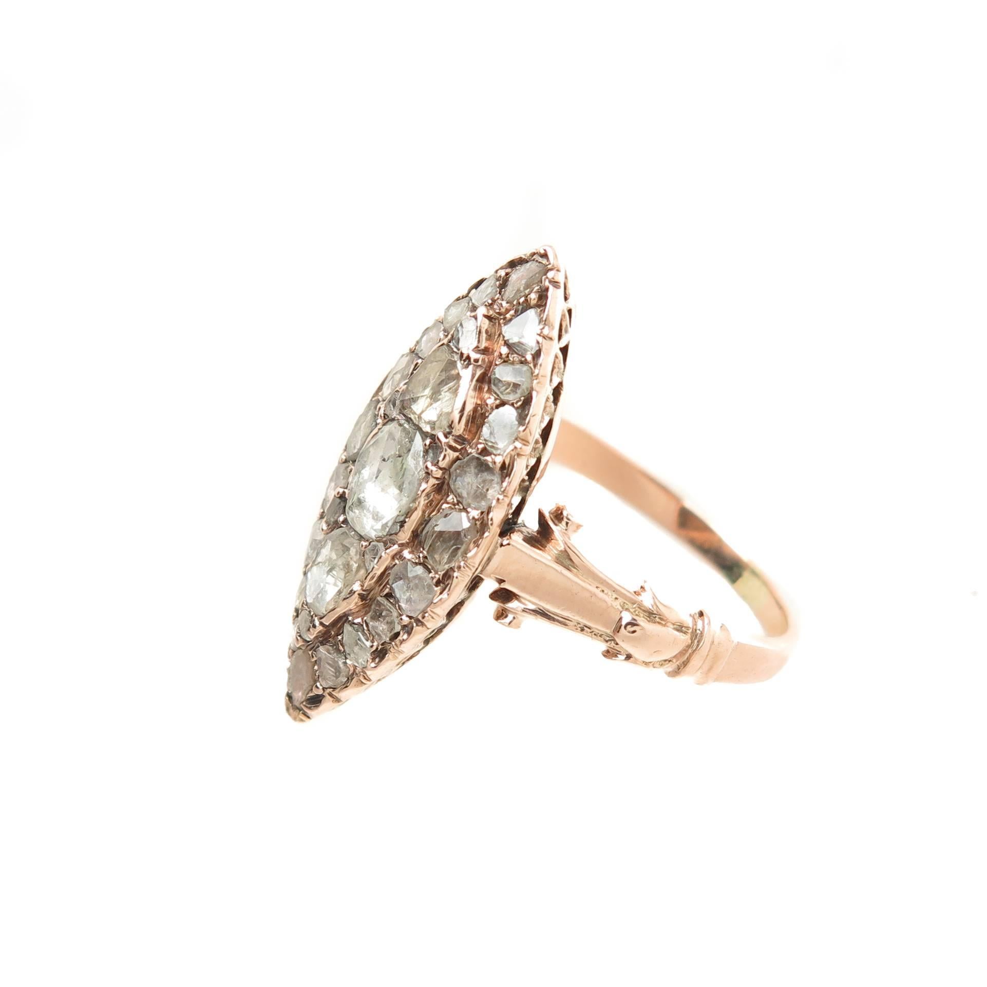 Circa 1850 Rose Gold Navette Ring, measuring 1 inch in length. Set with Rose Cut Diamonds in varying sizes totaling approximately 1.25 carats. Finger size 7. Excellent all original condition.  