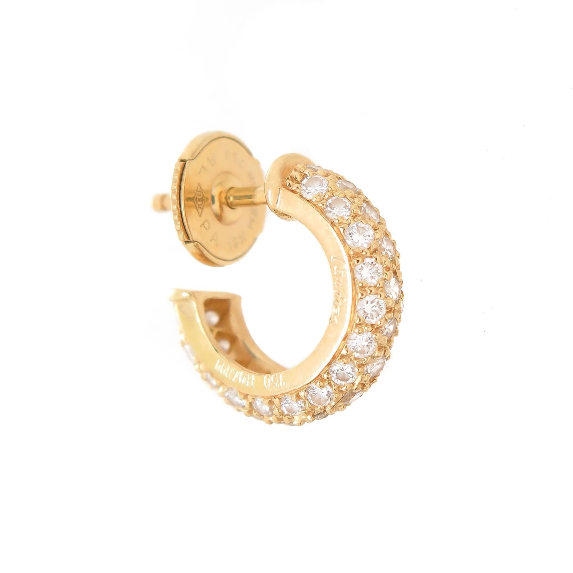Circa 2010 Cartier 18K Yellow Gold Mini Hoop / Hugge Earrings, measuring 1/2 inch in length and diameter. Pave set with Fine White round Brilliant cut Diamonds totaling .35 carat.  Have pressure fit backs on posts. Comes in a Cartier Presentation