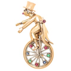 Whimsical Yellow Gold and Gem Set Figural Unicycle Clown Clip Brooch, 1940s