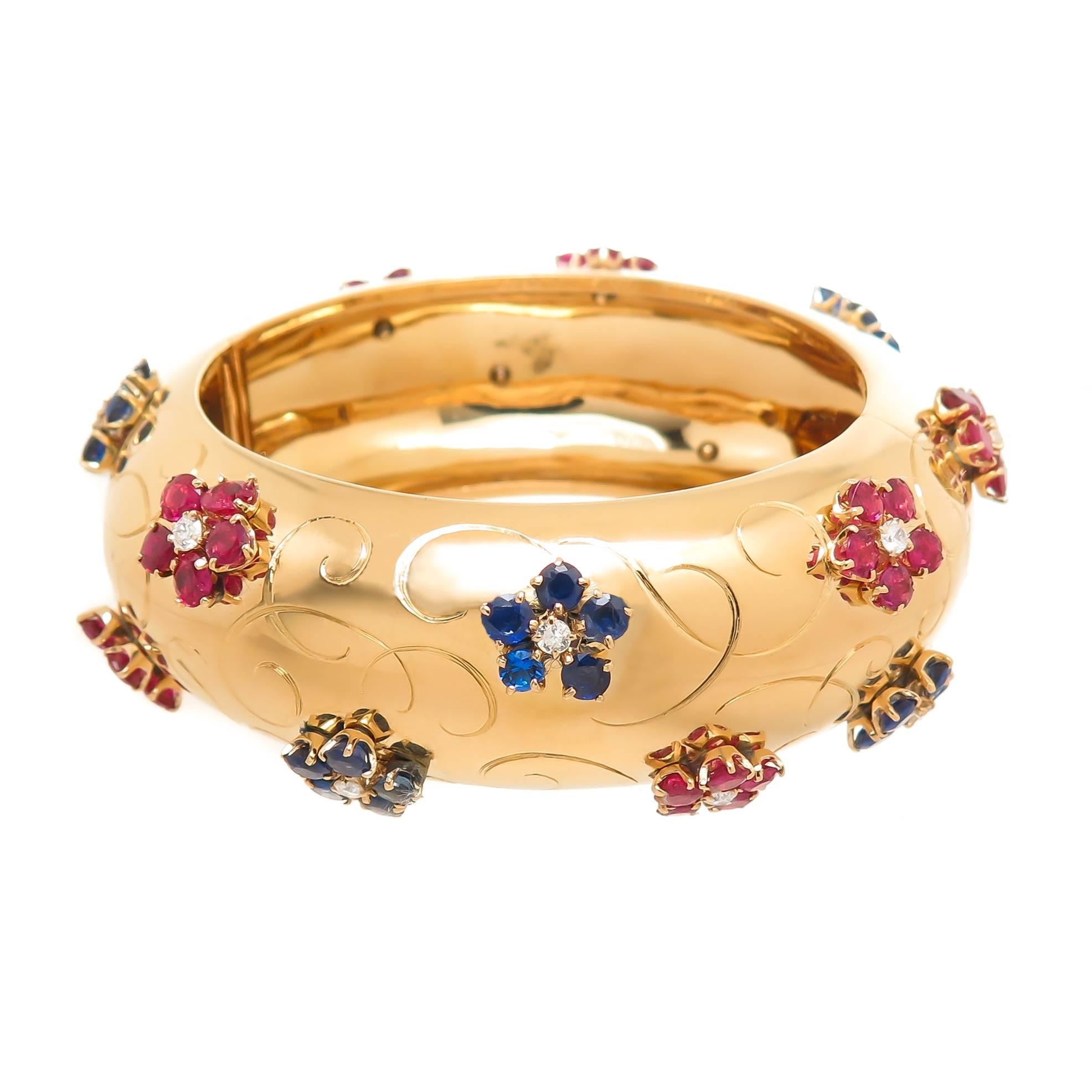 Circa 1940s Van Cleef and Arpels Large and Impressive Bangle Bracelet, in period Patriotic colors and in the design style of John Rubel for VCA. Measuring 1 inch wide with an inside measurement of 6 1/4 inch and weighing 93 Grams. Set with Fine