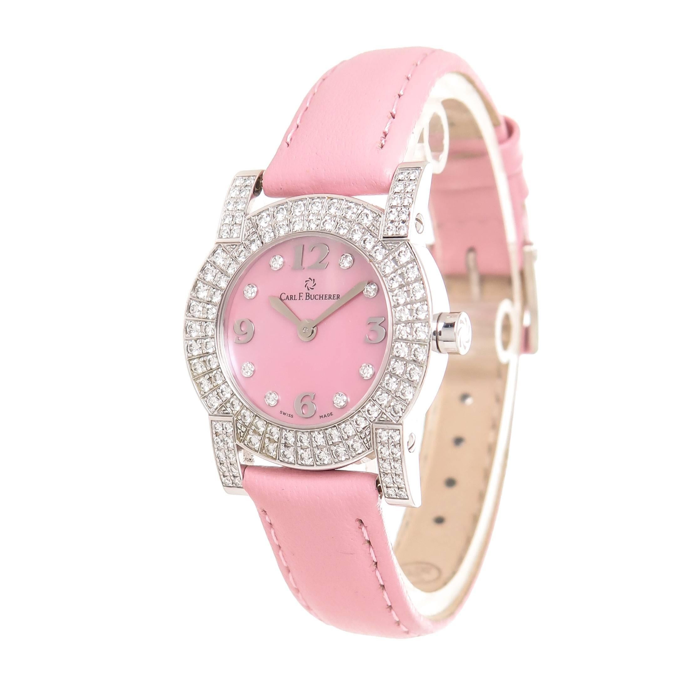 Circa 2012 Carl Bucherer Pathos Ladies Wrist watch, 27 MM 18K White Gold case, set with round Brilliant cut Diamonds totaling approximately 2 carats and Grading as F-G color and VS in Clarity. Quartz Movement, Pink Mother of pearl Dial with Diamond