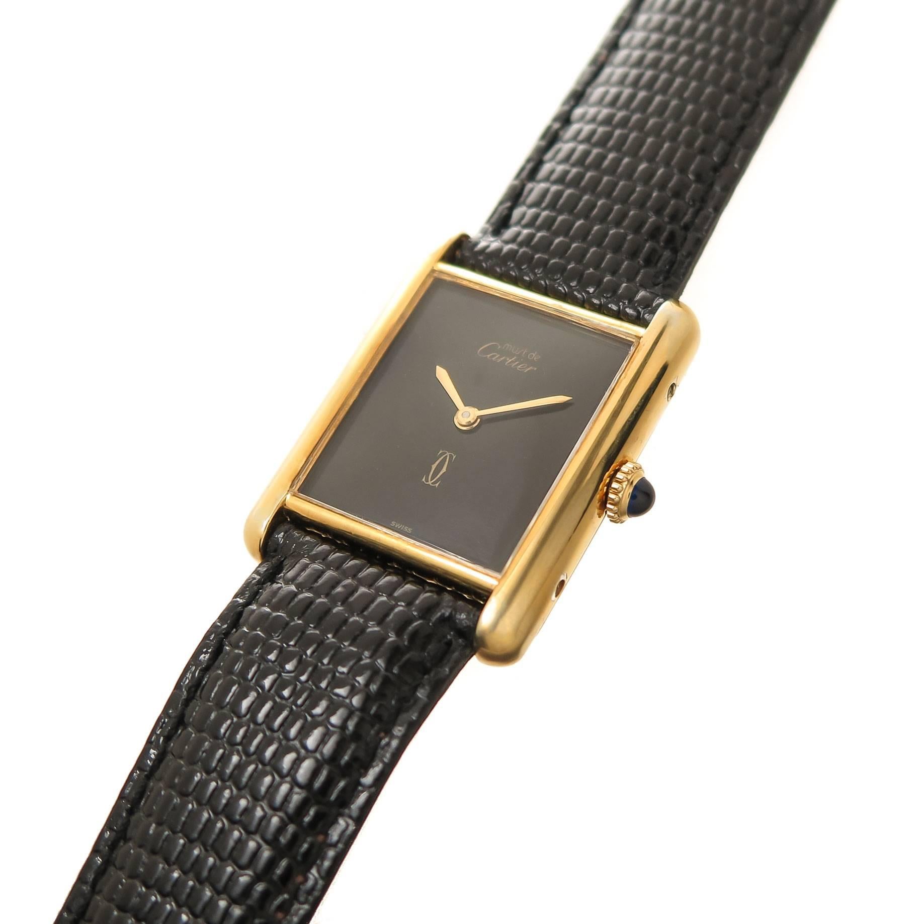 Circa 1990s Cartier, Must De Cartier collection classic Wrist Watch, 30 X 24 MM Vermeil, Gold Plate on Sterling Silver case. 17 jewel Manual wind mechanical movement, Black Dial with Gold hands, sapphire crown. New Black Lizard strap with original