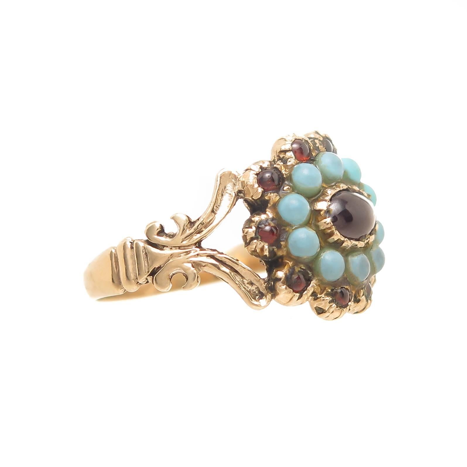 Circa 1840s 14k Yellow Gold George III period ring, set with Cabochon Garnets and Turquoise, the top of the ring measures 1/2 X 1/2 inch. Finger size = 8 1/2. Excellent condition. 
