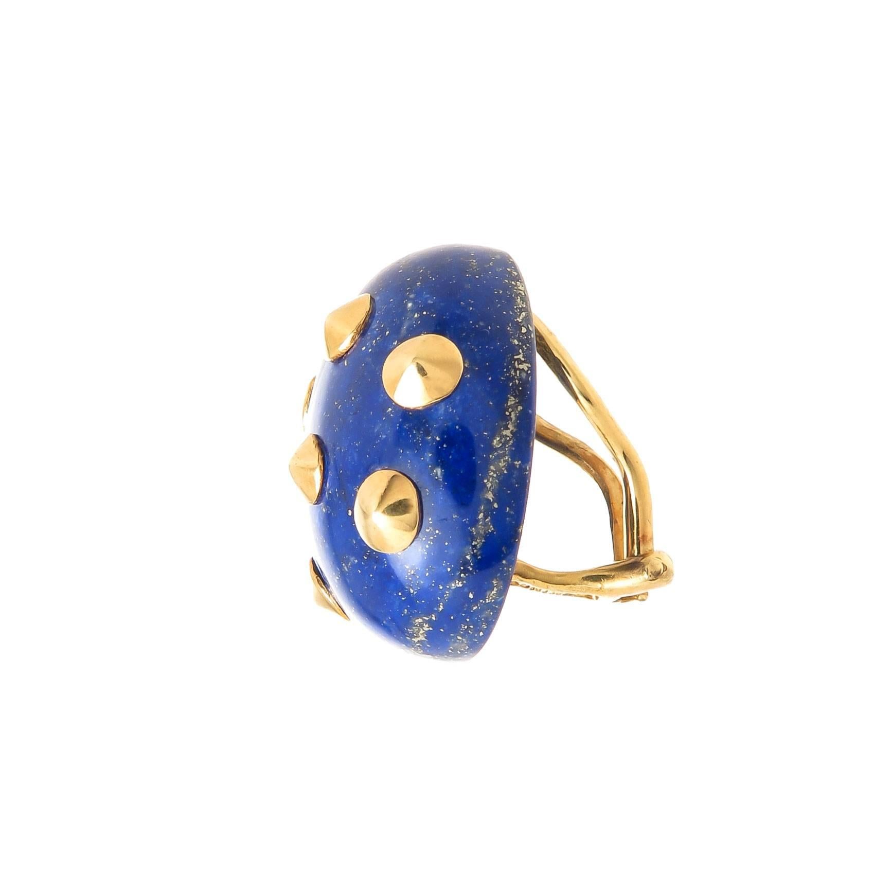Circa 1990 Angela Cummings Lapis Lazuli and 18k yellow Gold Earrings measuring 1 inch in Length X 3/4 inch and 3/8 inch thick.  Having Raise Gold pieces and Omega Backs to which posts can be easily added if Desired.