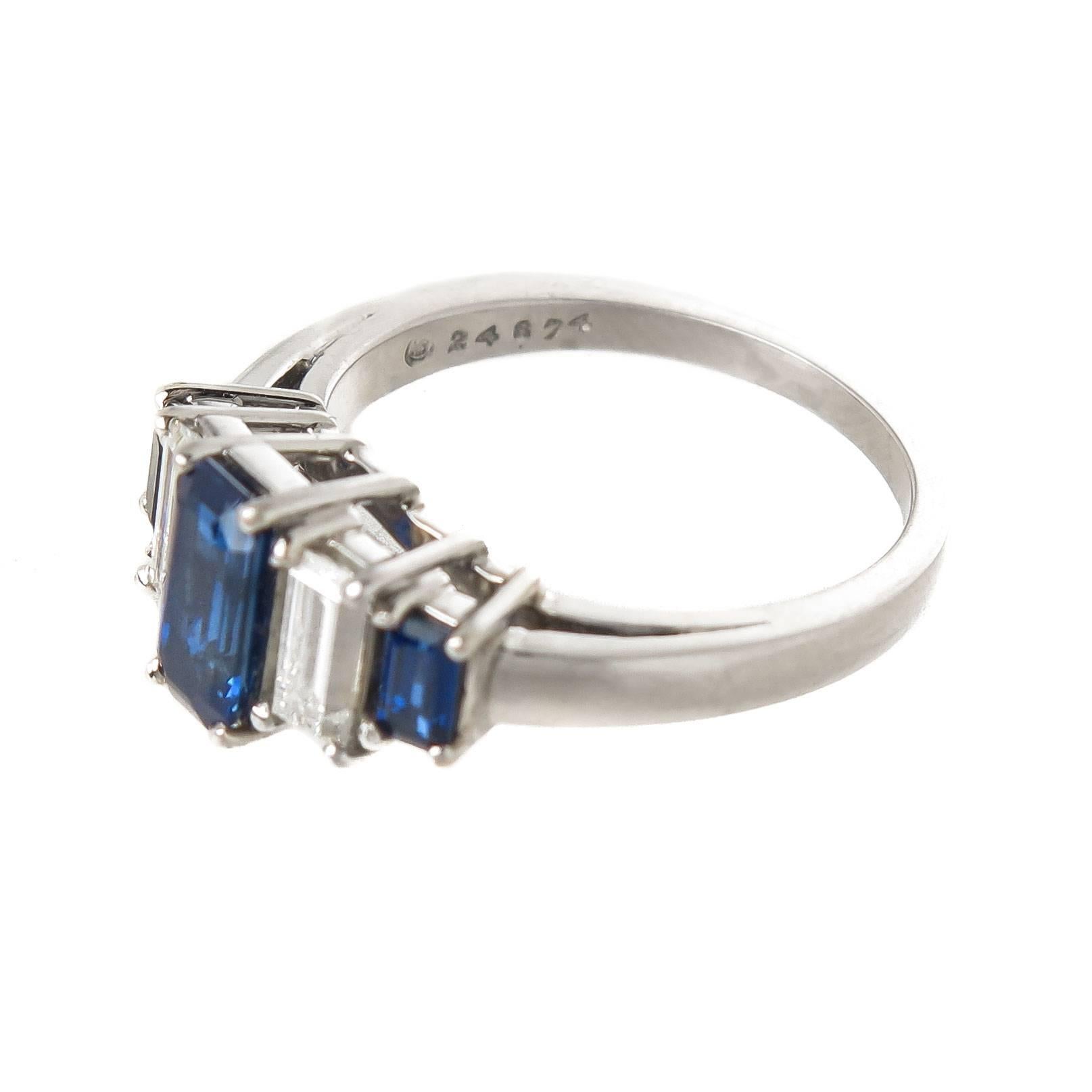 Circa 1960 Oscar Heyman Platinum Art Deco Style Ring, Having 3 Fine Color Step cut Sapphires totaling 1.15 Carats and 2 Step cut Diamonds totaling .53 Carat.  Finger size = 6. Measuring 1/2 inch across the top.
