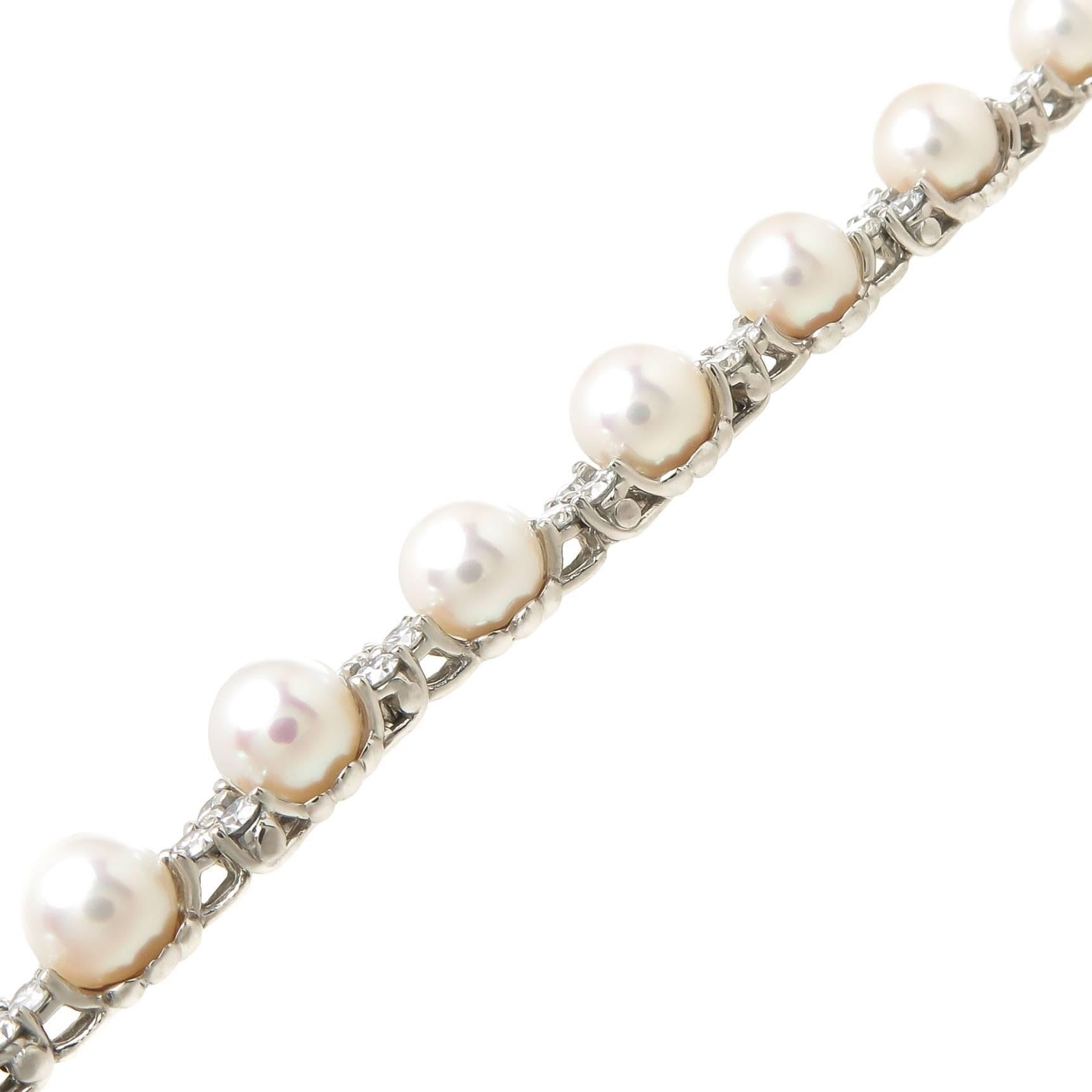 Circa 2010 Tiffany & Company Aria Collection Platinum Bracelet, measuring 1/4 inch wide and set with 48 Full cut Round Brilliant Diamonds totaling 2.18 Carats and further set with 16  6.5 - 7 MM very fine Cultured Pearls having a fine Whitish Pink