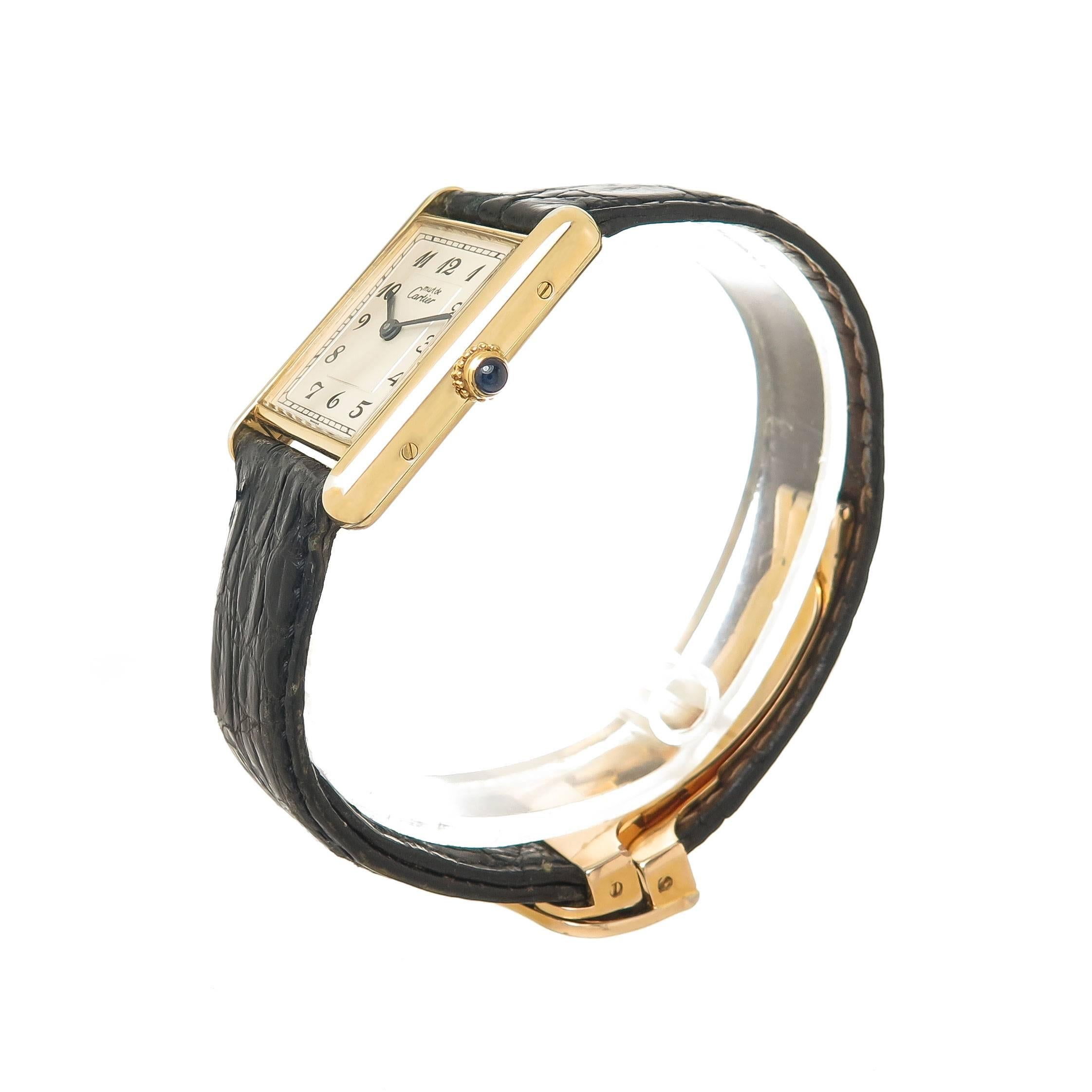 Circa 1988 Cartier Must De Cartier Standard Size Classic Tank Wrist Watch, 30 X 24 MM Vermeil ( Gold plate on Sterling Silver ) 2 Piece case.  Silver - White Stepped Dial with Black Arabic Numbers, Quartz Movement, sapphire crown. Original Cartier