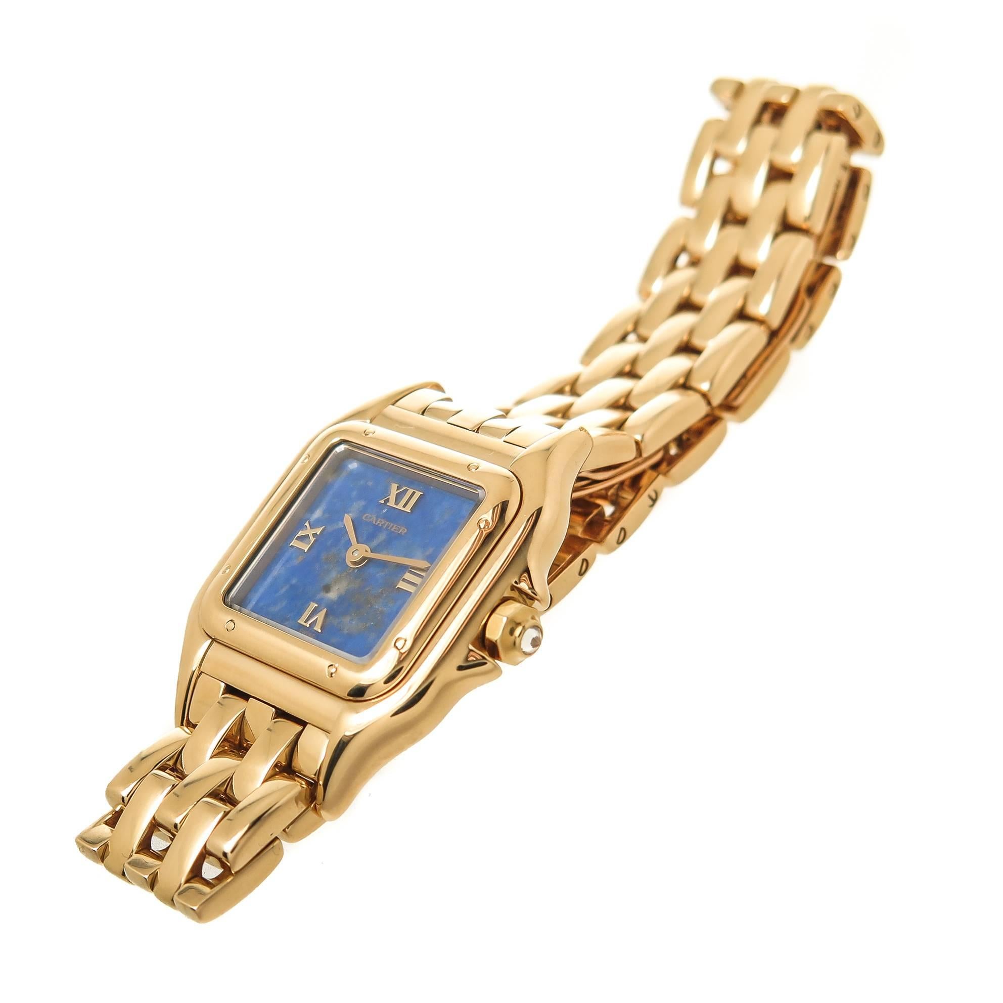 Circa 1990 Cartier Ladies Panther Wrist Watch, 30 X 22 MM water resistant case, Quartz Movement, Rare Lapis Lazuli Dial with Raised Gold Markers and a Diamond set Crown. 1.2 inch wide Panther link bracelet with Fold over Deployment clasp.  Total