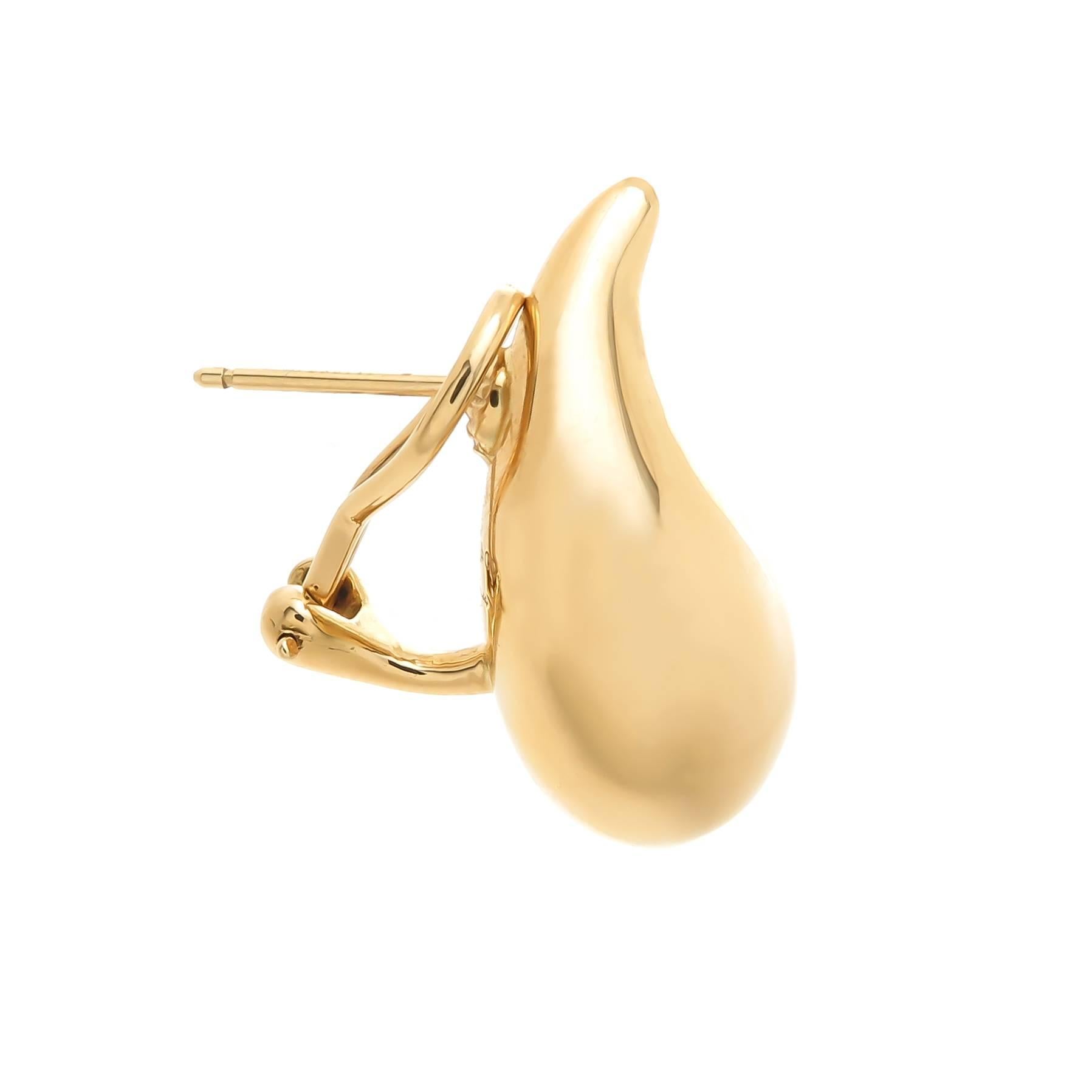 Circa 1990s Elsa Peretti for Tiffany & Company 18K Yellow Gold Tear drop collection Earrings. Measuring 1 inch in length X 1/2 inch wide and weighing 19 Grams total for the pair. Having Omega Clip Backs with a post. 