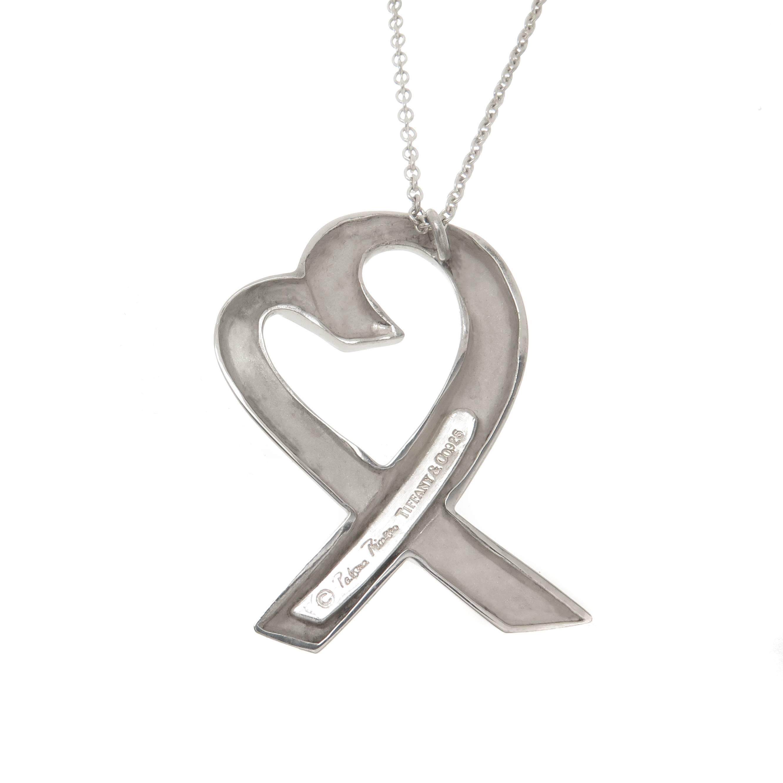 Circa 2000 Paloma Picasso for Tiffany & Company Sterling Silver Loving Heart necklace. This being the Largest of the Heart Pendants measuring 1 3/4 inch X 1 3/16 inch. Suspended from a 32 inch Tiffany link chain. 