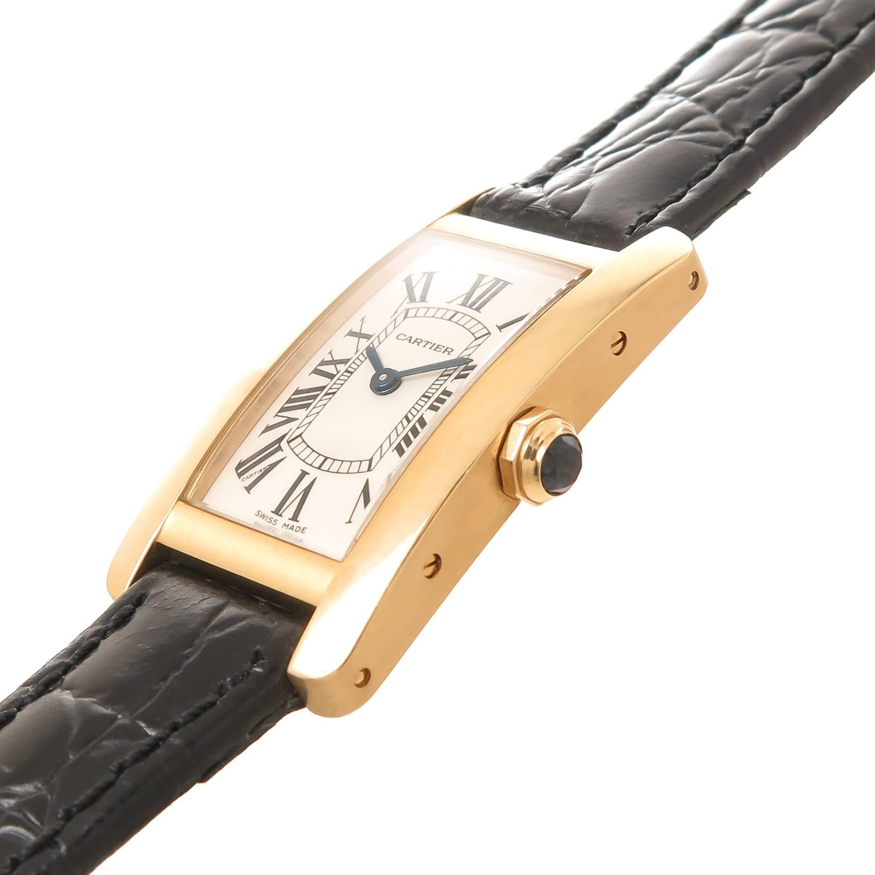 Circa 2000 Cartier Tank American ladies wrist watch,  34 X 19 MM 18K Yellow Gold water resistant case. Quartz Movement, White dial with Black Roman Numerals, Sapphire Crown. New Hadley Roma Black textured leather strap with original Cartier Yellow