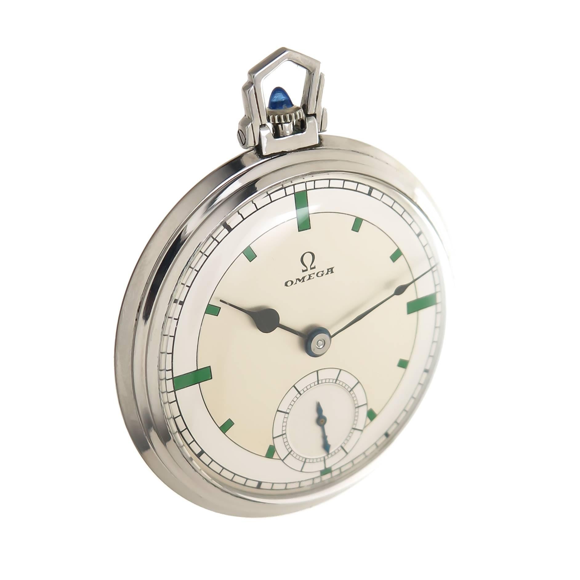 Circa 1930s Omega Pocket Watch, 39 MM Stainless Steel Signed Omega Stepped Case. 15 Jewel Manual Wind movement, Sapphire Crown. Two Tone Silver dial with Green Enamel Markers and a sub seconds chapter. Excellent condition. Recently serviced and