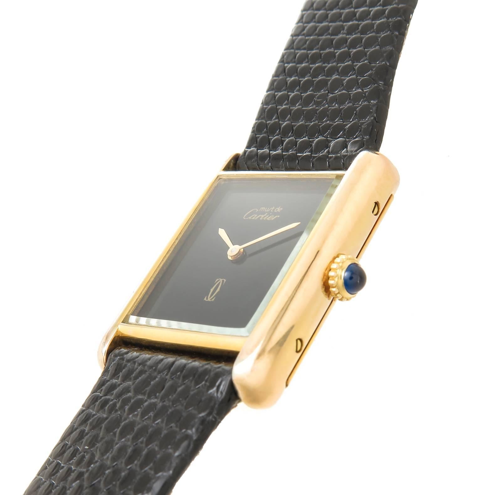 Circa 1990s Cartier, Must De Cartier, Classic Tank Vermeil, ( Gold Plate on Sterling Silver ) Wrist watch. 30 X 24 MM Case, Mechanical, Manual winding 17 Jewel movement. Black Dial , sapphire Crown. New Black Lizard strap with Original Cartier Gold