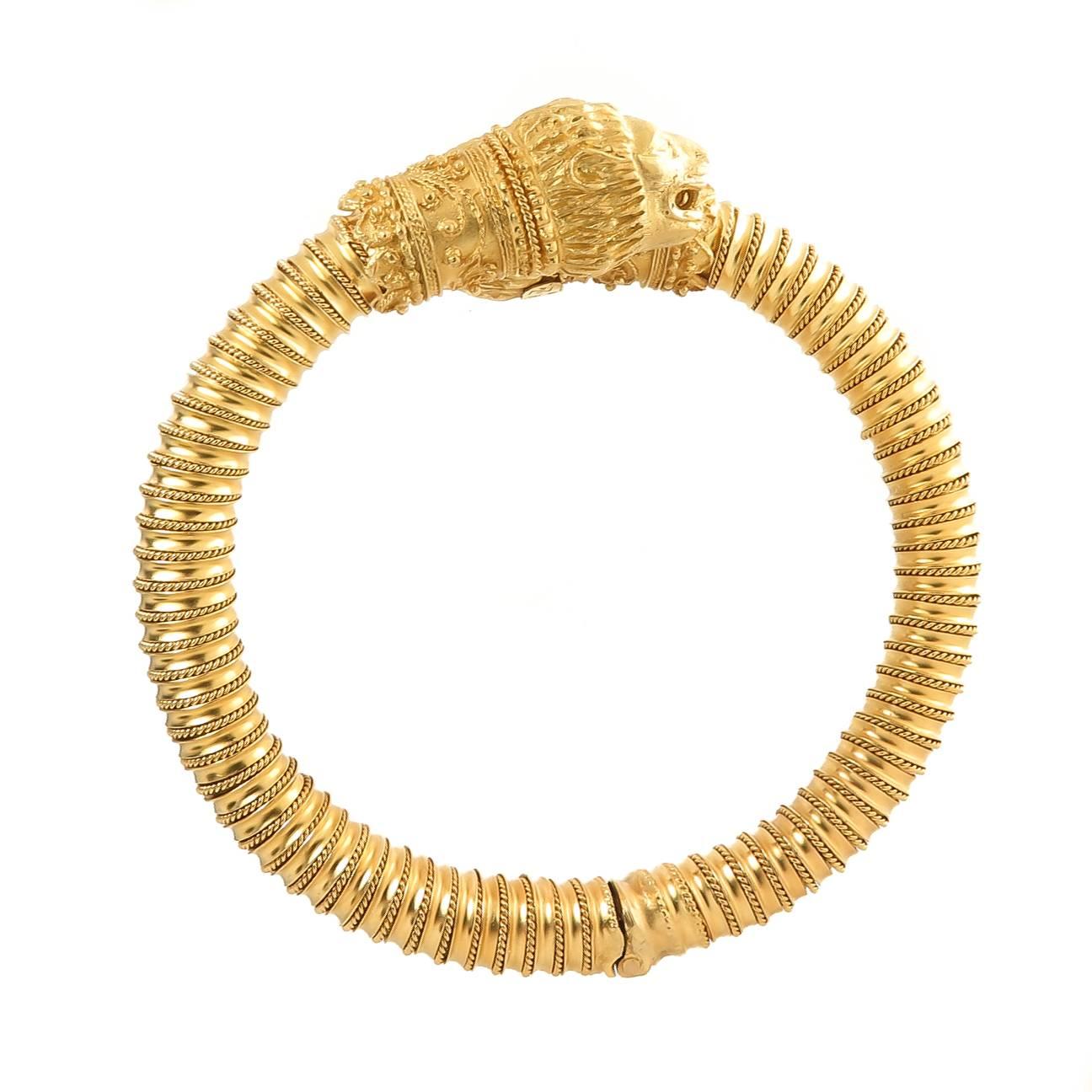 Circa 1980s Zolotos 22K Yellow Gold Chimera Lion Head Bracelet, This solid bracelet measures 5/16 inch Diameter thick, the Lion Heads measure 5/8 X 1/2 inch. The inside measurement is 6 1/2 inch and the bracelet has a hinge and is adjustable for up