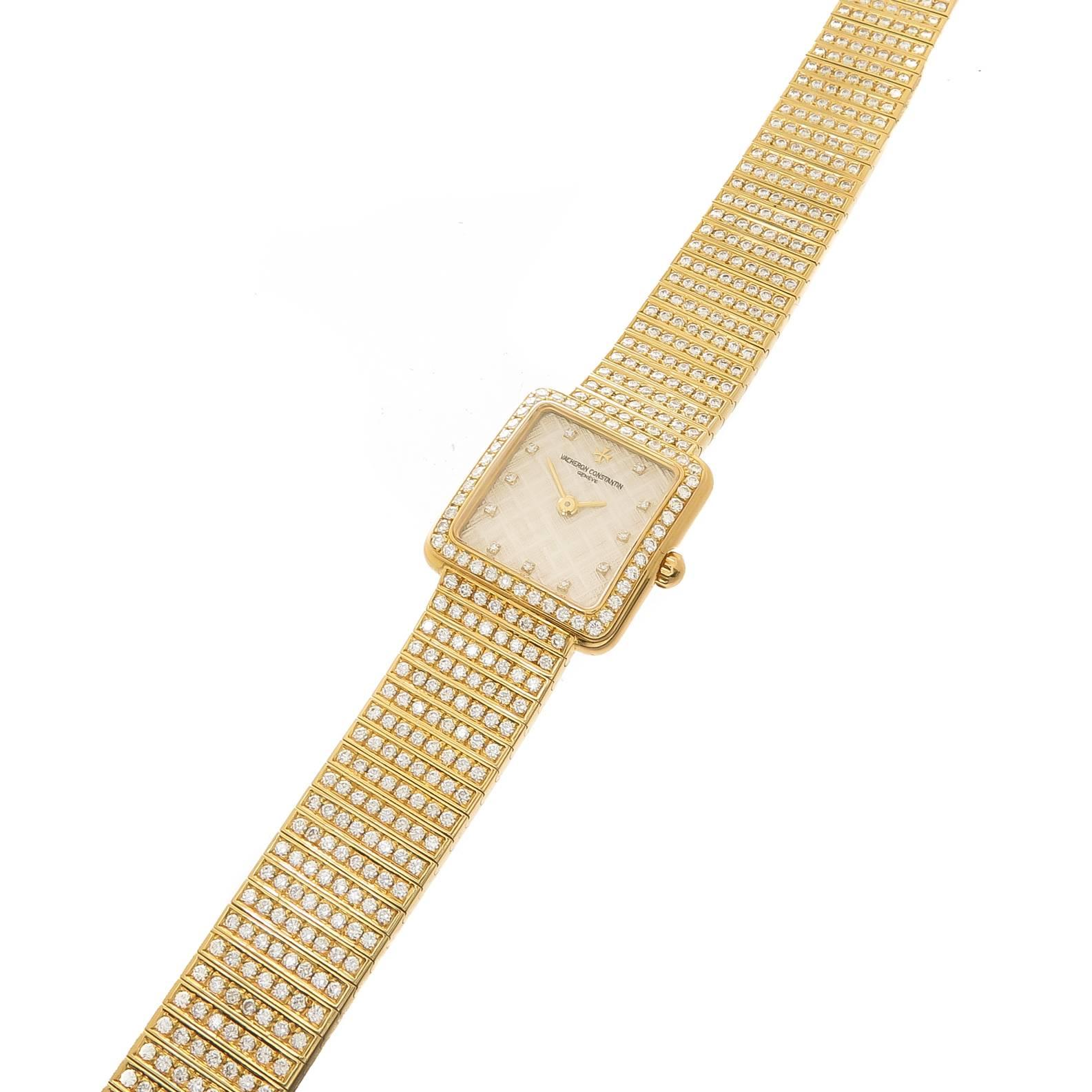 Circa 2000 Vacheron Constantin Ladies 18K Yellow Gold High Jewelry Collection Wrist Watch. Diamond set Bracelet and Bezel of Round Brilliant cuts totaling 5 carats and Grading as VS in Clarity and F-G in color. Caliber 1055 21 Jewel Manual wind