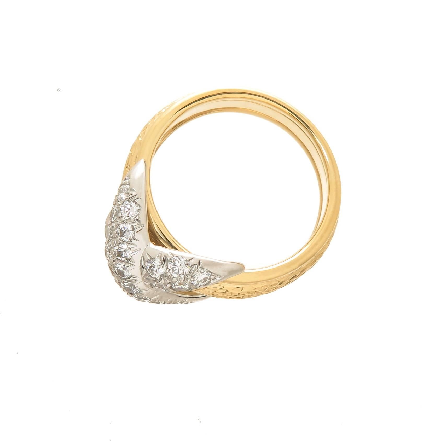Circa 2000 18k Yellow Gold, Platinum and Diamond X Ring by Jean Schlumberger for Tiffany & Co. 28 Round Brilliant Cut Diamonds totaling approximately 1 carat and grading as VS1 clarity and F-G Color. The ring top measures 1/2 X 3/8 inch, finger