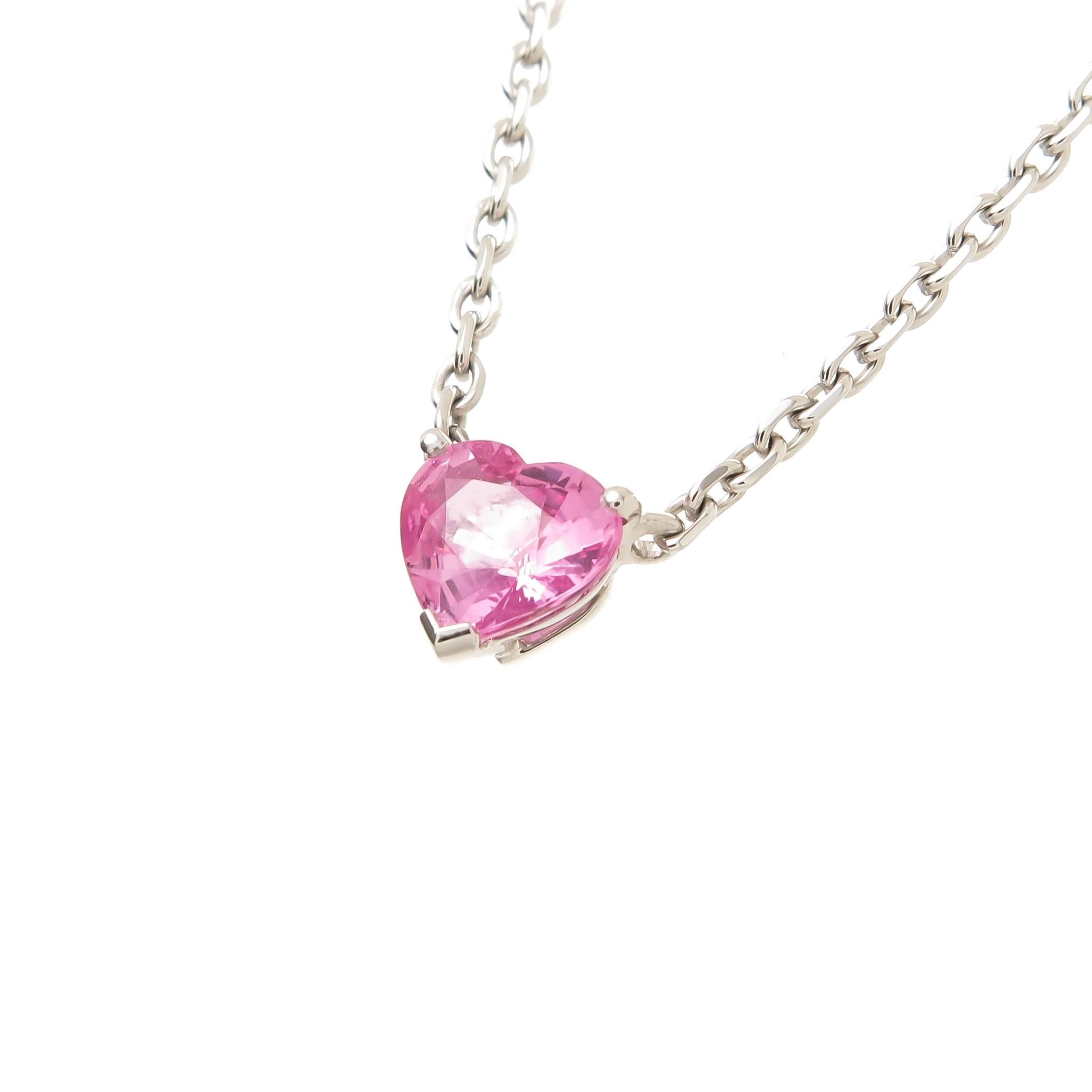 Circa 2015 Cartier Pink Sapphire Heart necklace, 18K White Gold and set with a very Fine, intense color Pink Heart Shape Sapphire of 1.25 Carats, 16 inch adjustable chain. Signed, Numbered and comes in the original Cartier presentation box.