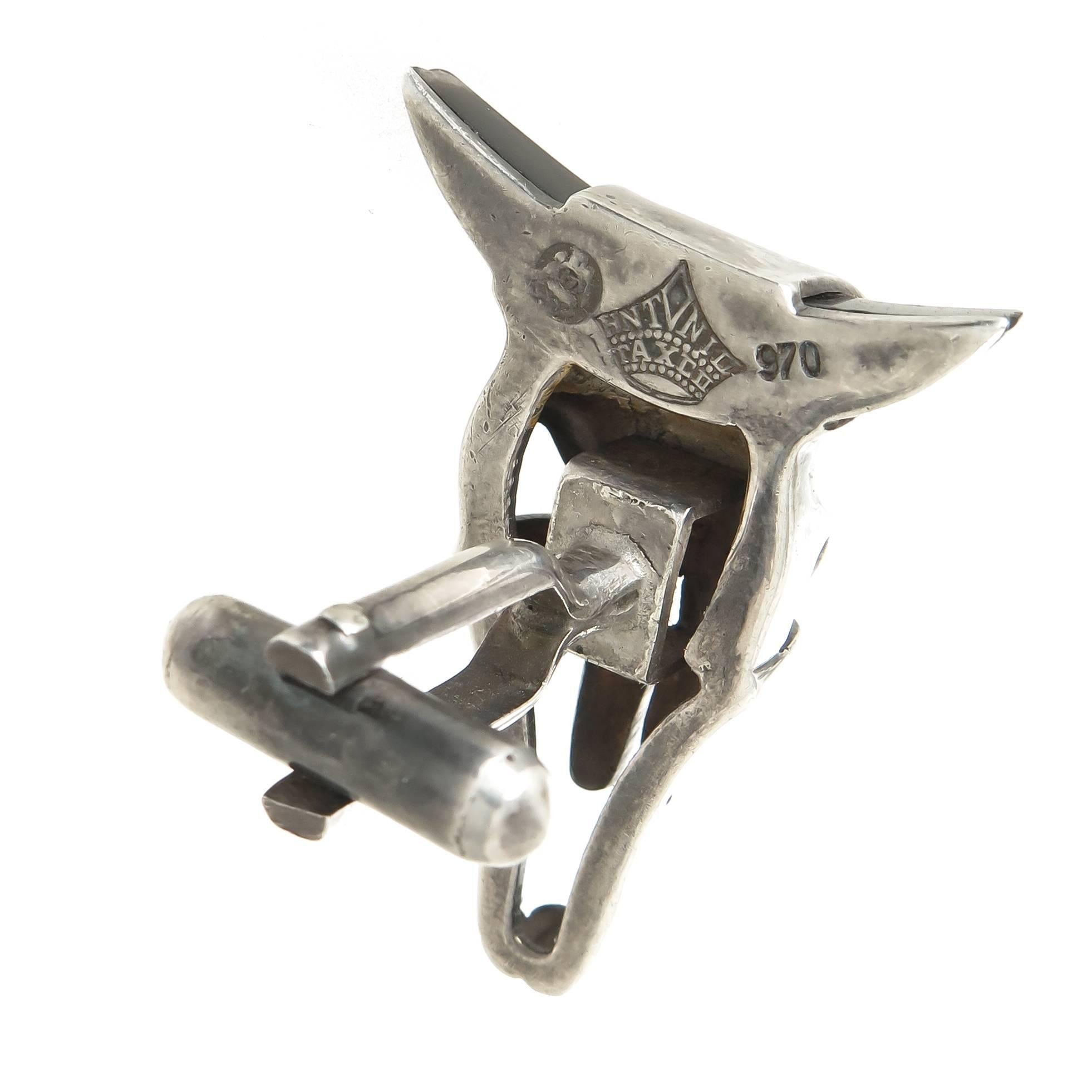 Circa 1950s Sterling Silver Animal Skull Cufflinks by Taxco Silver Master Antonio Pineda, measuring 1 1/4 inch in length and 1 1/8 inch wide, having Black Onyx set Horn Ends.  Great Form with nice detail.