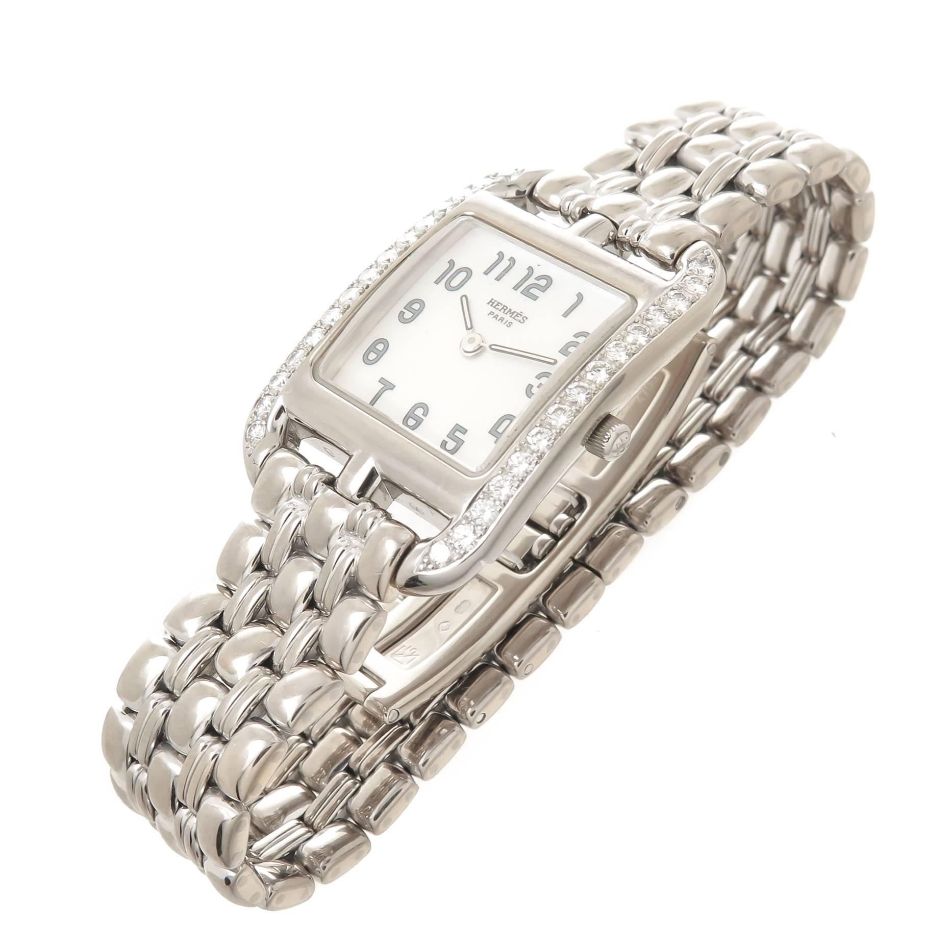 Circa 2012 Hermes Ladies Cape Cod Wrist Watch, 33 X 23 M.M. 18K White Gold Case with Diamonds set on either side and totaling 1 Carat. Quartz Movement, White Mother of Pearl Dial. 5/8 inch wide 18K White Gold Link Bracelet with fold over Deployment