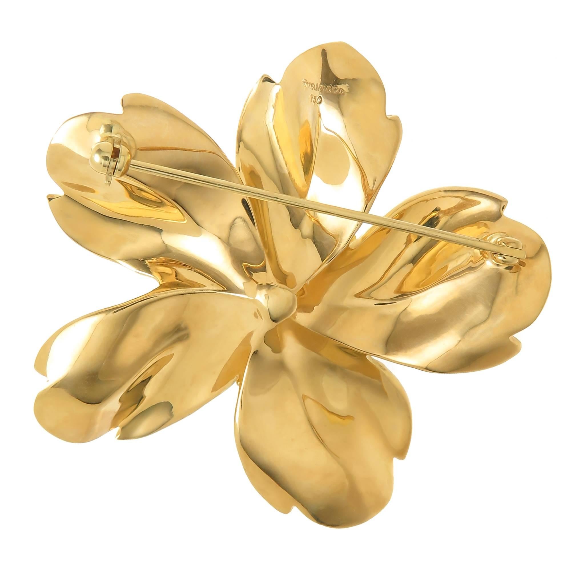 Circa 2000 Tiffany & Company 18K yellow Gold Flower Brooch, measuring 2 inch in diameter and weighing 34 Grams. Very Detailed with a light frosted, brushed finish. Excellent condition. Comes in a Tiffany Gift Box. 
