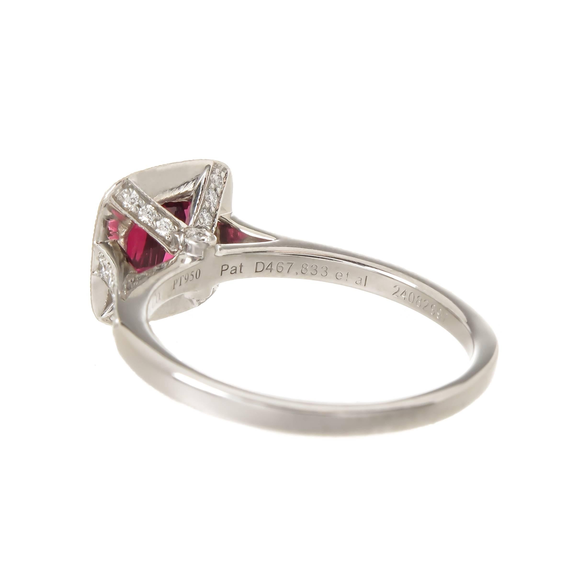 Circa 2015 Tiffany & Company Platinum Ring, centrally set with a very fine, intense color Cushion cut Rubellite of approximately 1.50 Carats and surrounded by 16 Round Brilliant cut Diamonds totaling .48 Carat, further set with 12 Round Brilliant