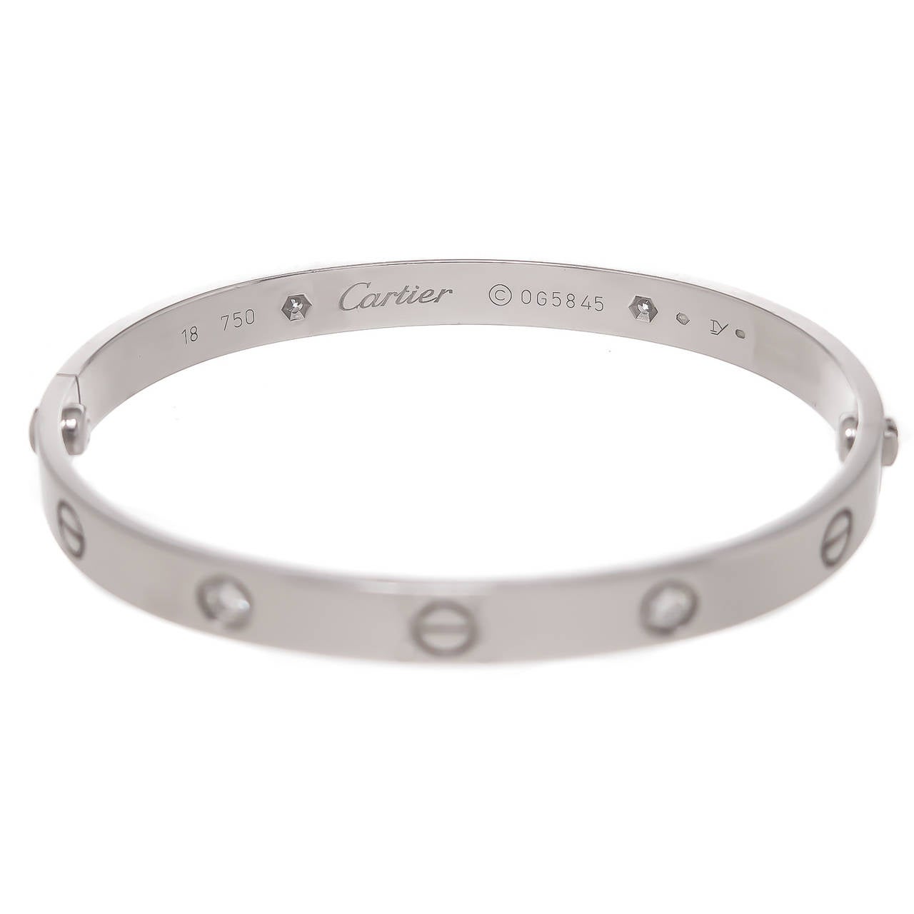 Cartier 18K White Gold Love Bracelet, set with 4 Round Brilliant cut Diamonds. Wrist size 18. Signed, Numbered and Having French Hall Marks. With Screwdriver and Cartier Presentation box.