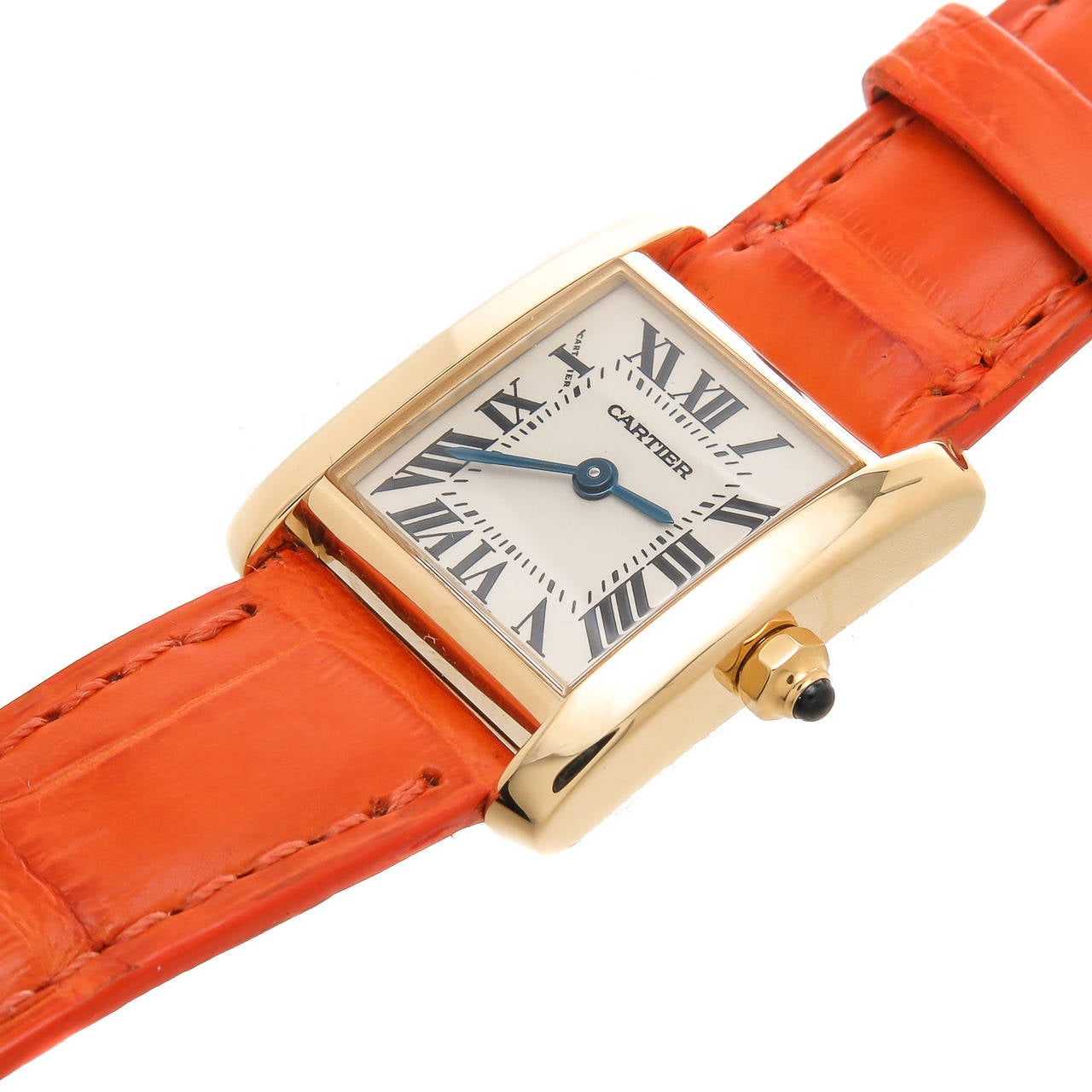 Circa 2010 Cartier 18K yellow gold Tank Francaise, water resistant case measuring 25 MM  X  20 MM. Quartz movement, white dial with black Roman numerals. Sapphire crown. New Cartier padded light orange-brown strap with Cartier 18K gold buckle.