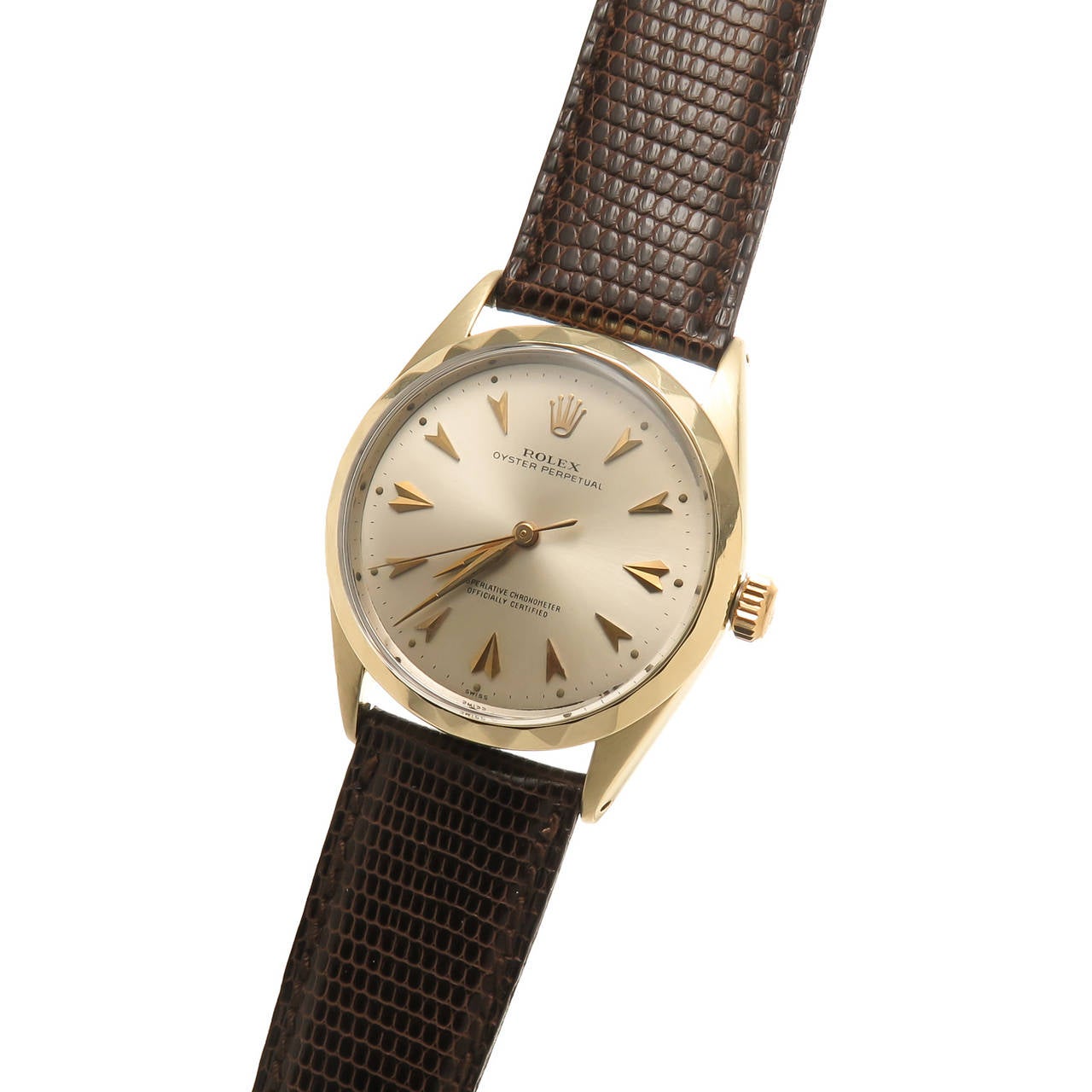 Circa 1960s Rolex reference 1025, 34 MM heavy Gold Shell With steel back case, Oyster perpetual. Automatic self winding 26 jewel, Caliber 1560 movement. Original mint condition silvered dial with raised Gold Arrowhead Markers and an unusual scarce