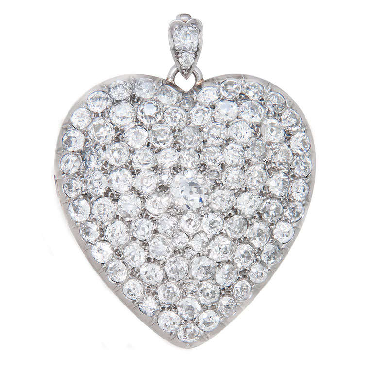 Circa: 1915 Large, Platinum and Diamond set Heart Locket, Containing just  over 10 Carats of Old mine and European cut Diamonds that are white and Clean. 1.3/8  X  1 3/4 inch.