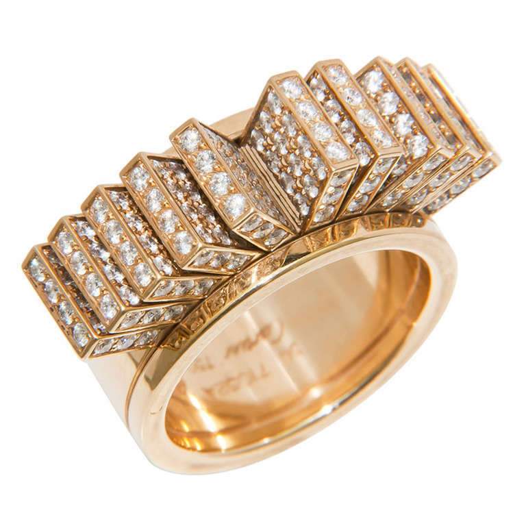 Very Unusual, Circa 2000 18K Yellow Gold and Diamond Ring by Cartier, set with 4.50 Carats of fine white Diamonds, the top of the ring has 10 articulated sections that fan out with motion of the hand. Signed and numbered, Finger size = 8 ( 56