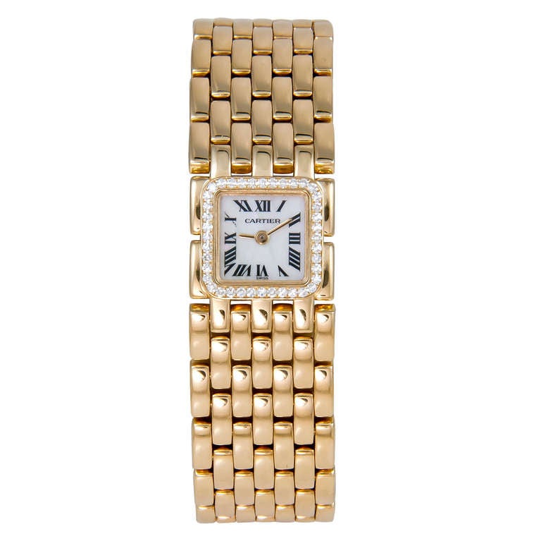 Cartier lady's 18k yellow gold Ruban bracelet watch, circa 2005. Quartz movement, mother-of-pearl dial and factory diamond bezel. Fits a 6 1/2 to 7-inch wrist and is adjustable by removing or adding links. Comes in original box.
