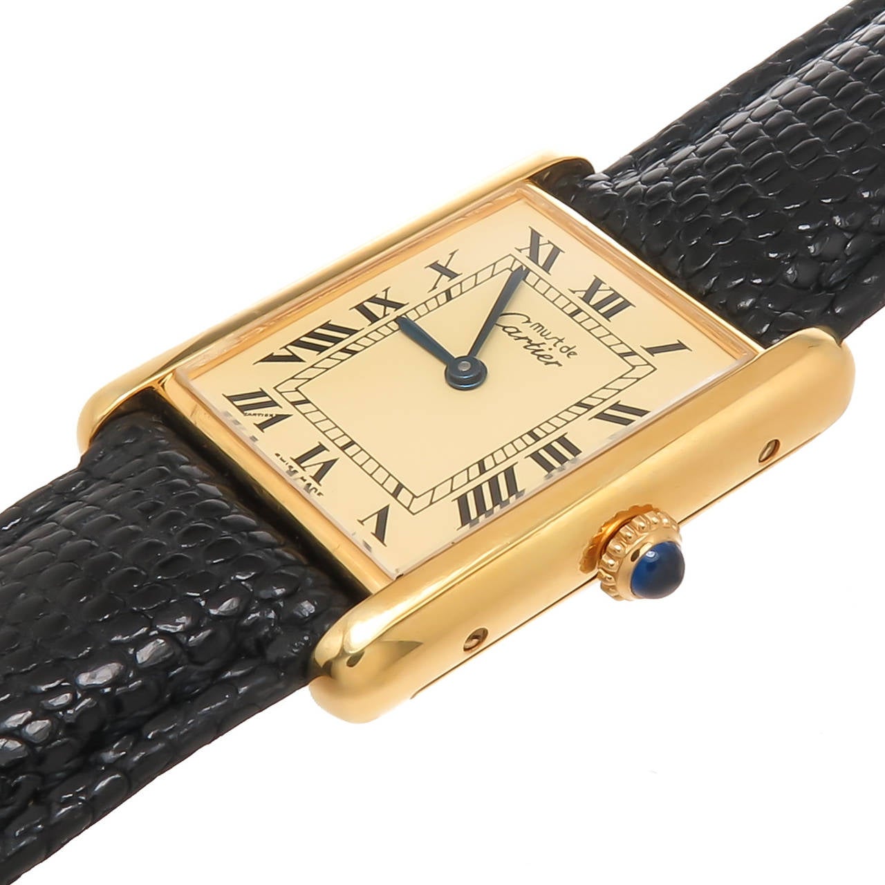 Circa 2005 Cartier Classic Vermeil, Gold Plate on sterling silver Tank Watch, measuring 1 1/4 X 7/8 Inch, Quartz Movement, light cream color Dial with Black Roman Numerals, Sapphire Crown. New Black padded Lizard strap with Gold Plated Cartier Buckle
