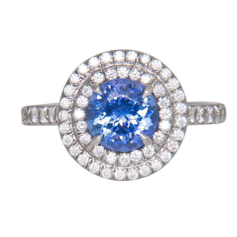 Tiffany & Company Platinum, Diamond and Tanzanite Ring from the Soleste Collection. Fine color Tanzanite weighing 1.25 Carat and surrounded by .46 Carat of Diamonds. Finger size = 6, Retail price new $7800.00