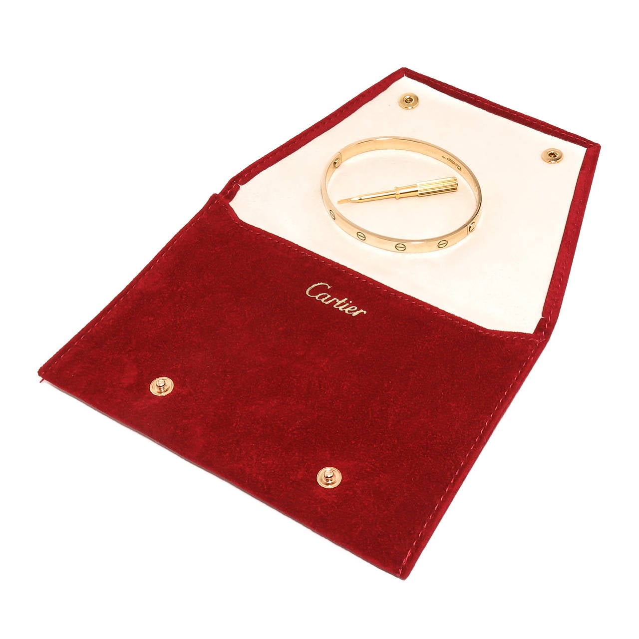 Circa 1990s Cartier 18K yellow Gold Love Bracelet. Size 20. Having original screwdriver and Cartier suede pouch. Signed and Numbered.