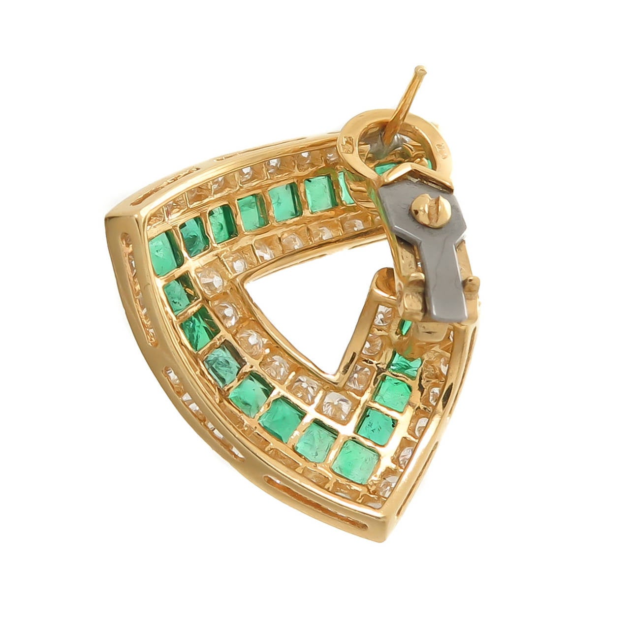 Circa 2000 18K Yellow Gold Earrings, set with 3 Carats of very Fine White Diamonds, F-G in Color and VVS in Clarity. Further Channel set with Square cut Emeralds that are of very Fine intense Color, possibly Colombian and totaling approximately 4