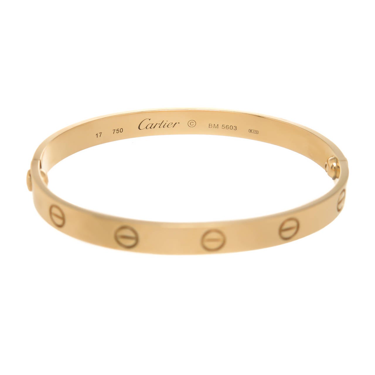 Circa 2005 Cartier Classic 18K Yellow Gold Love Bracelet size 17 and measuring 1/4 inch wide. Comes with Original Screwdriver and Cartier Red Suede Pouch. Signed, Numbered and having French Control stamps.