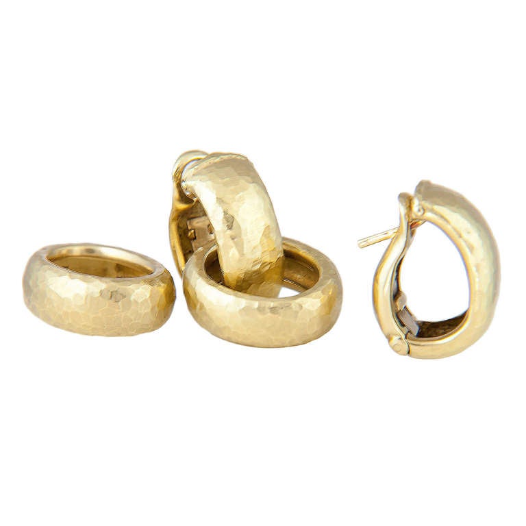 Circa 1990 18K Yellow Gold, hand Hammered Convertible Hoop Earrings by Tiffany & Co. Bottom Hoops are removable so tops can be worn as Hugges. Fold Down Posts for Pierced or Non pierced ears.