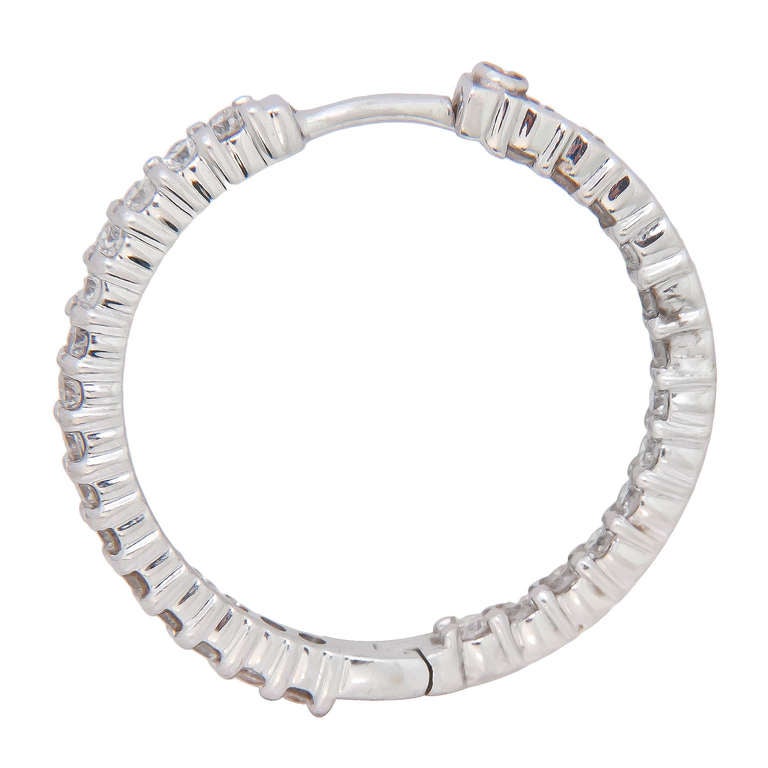 18K White Gold and Diamond Inside Out, Hoop Earrings by Roberto Coin, set with 56 Fine White Round Brilliant Cut Diamonds totaling approximately 1.60 Carats.