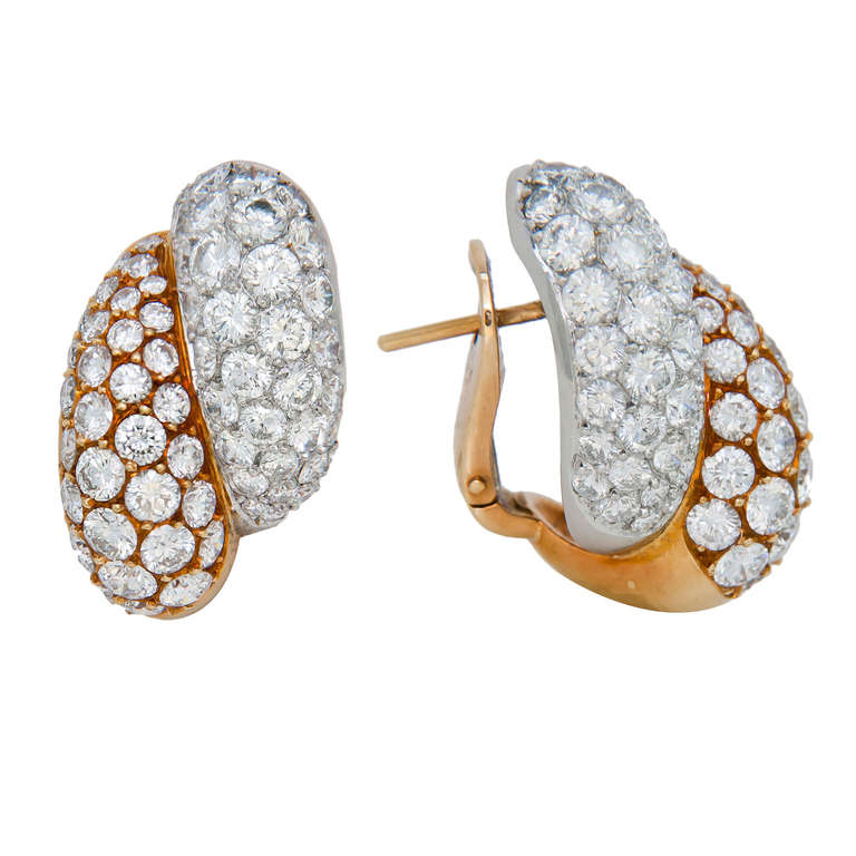 A very Fine Pair of 18K White and Yellow Gold and Diamond Ear Clips by Fred Paris, set with Fine White Round Brilliant Cut Diamonds totaling 6 Carats. Posts with Clip Backs. Very Substantial in size being 5/8 inch wide and a bit over 1 inch in