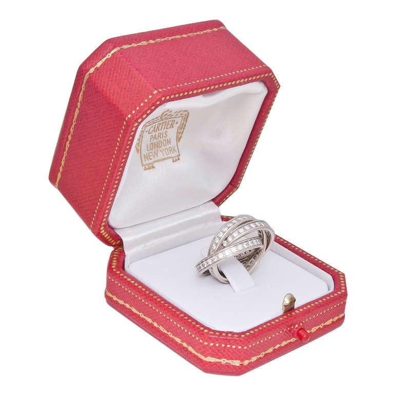Circa 2010 Cartier 18K White Gold and Diamond 3 band Trinity Ring.Set with over 3 carats of Fine White Round Brilliant cut Diamonds. Finger size 6. Signed and Numbered, original presentation box, $15,700.00 Retail.
