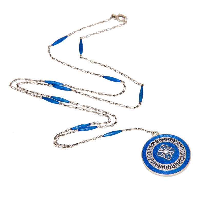 Circa 1920s Edwardian 14K Yellow Gold and Blue Guilloche Enamel Vinaigrette Locket Necklace. Fine Open cut out work and centrally set with a Diamond. Locket measuring 7/8 inch in Diameter.