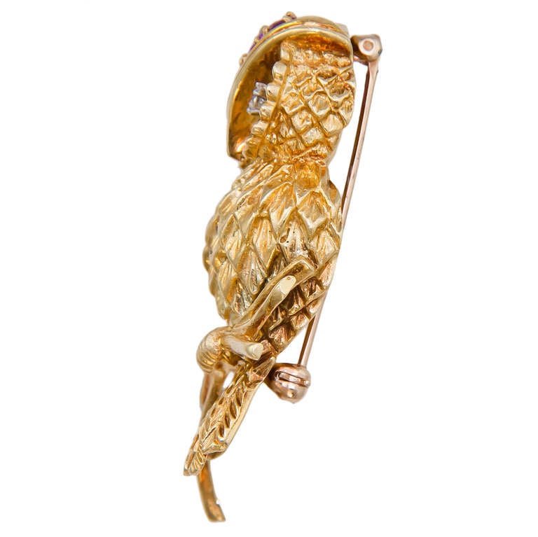 Circa 1970s 18K Yellow Gold and Gem Set Owl Brooch by Tiffany & Co. Nicely Detailed with Diamond set eyes and Rubies.