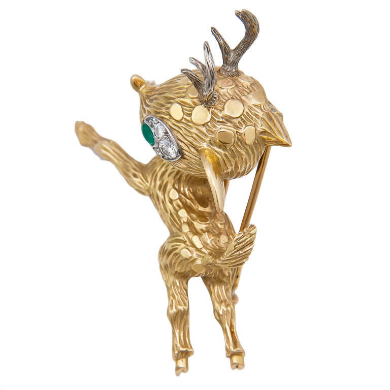 Circa 1970s 18K White and  Yellow Gold and Gem set Reindeer Brooch by Hermes, very detailed with a textured Finish and set with Diamonds and an Emerald. Signed and French Hallmarked.