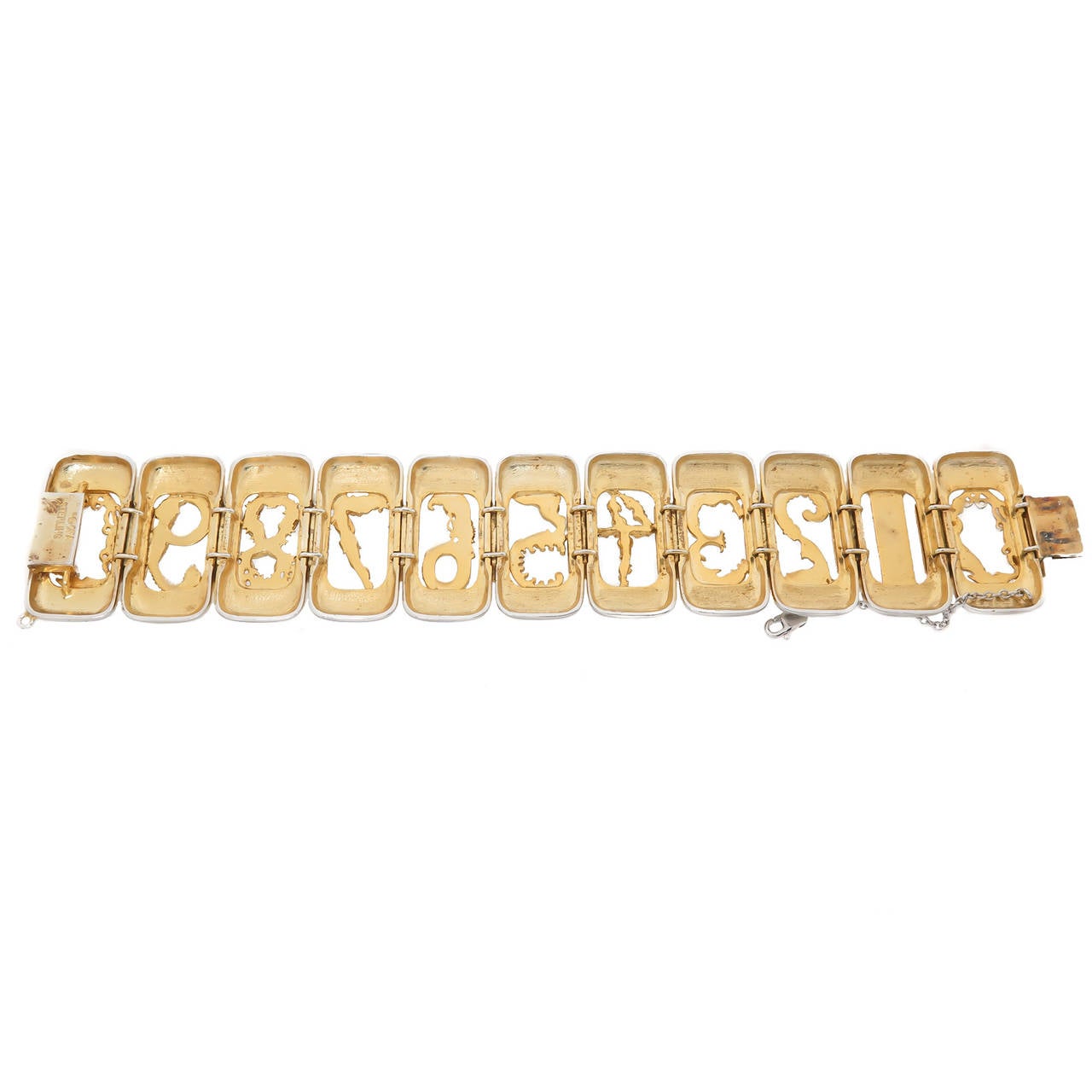 Circa 1980s Sterling Silver and Gold Wash Numbers Bracelet, measuring 7 1/2 inch in length and 1 3/8 inch wide. Signed Numbered and comes in the original Erte Circle Fine Art Gallery Presentation case.