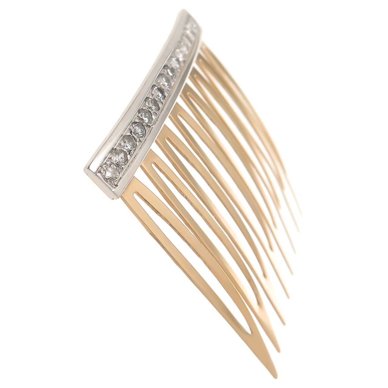 Circa 1970s 14K Yellow Gold and Diamond Hair Comb. Measuring 1 5/8 inch in length X 1 5/8 Inch and set with 16 Round Brilliant cut Diamonds totaling .65 Carat.
